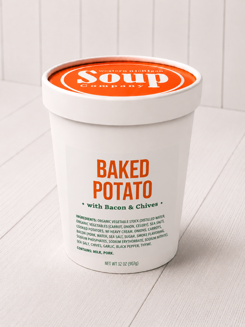 Container of 'Baked Potato with Bacon & Chives' soup from the WISoup Company on a white background