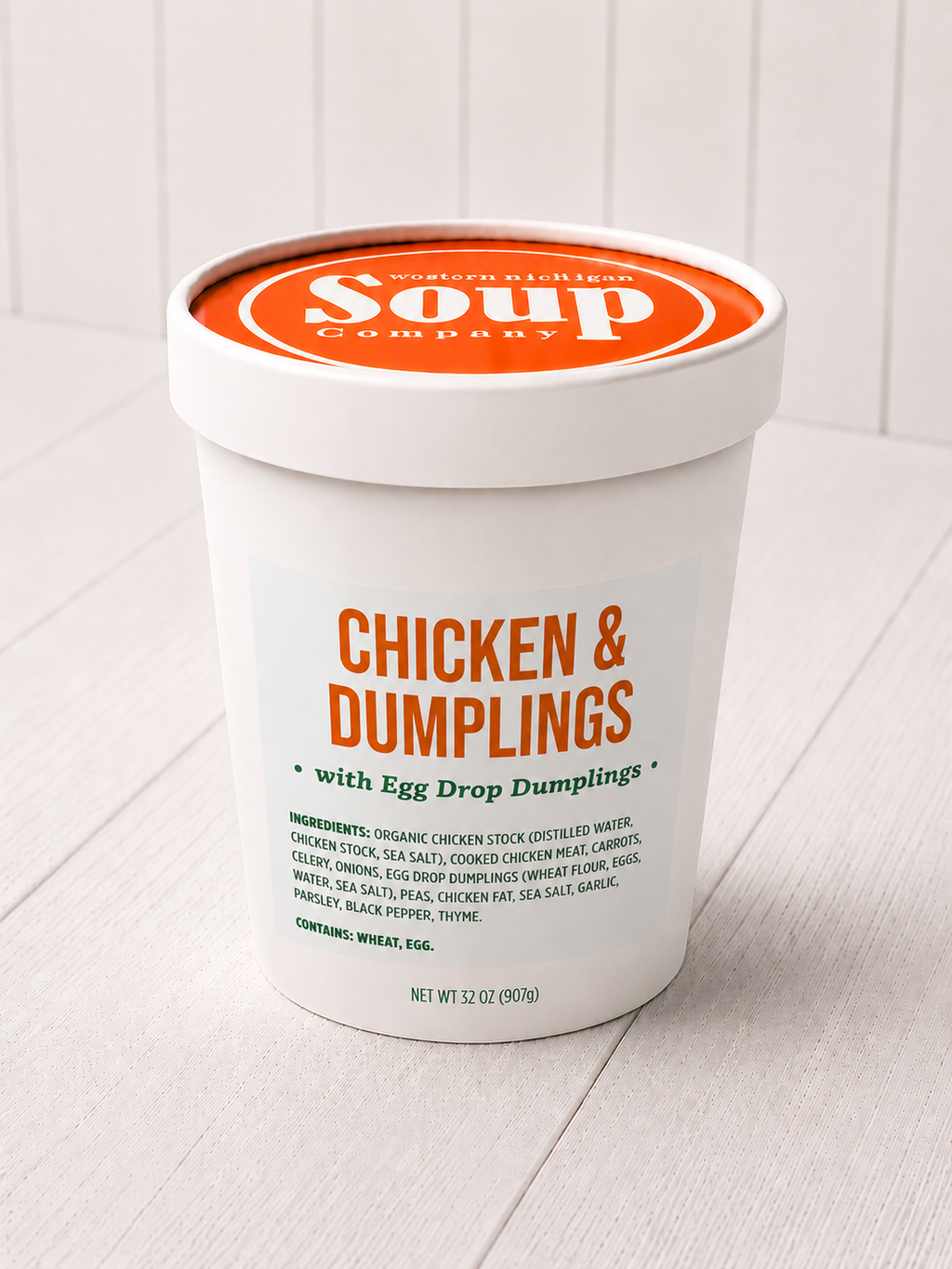 Container of chicken and dumplings soup with 'WISoup Company' branding on a white background