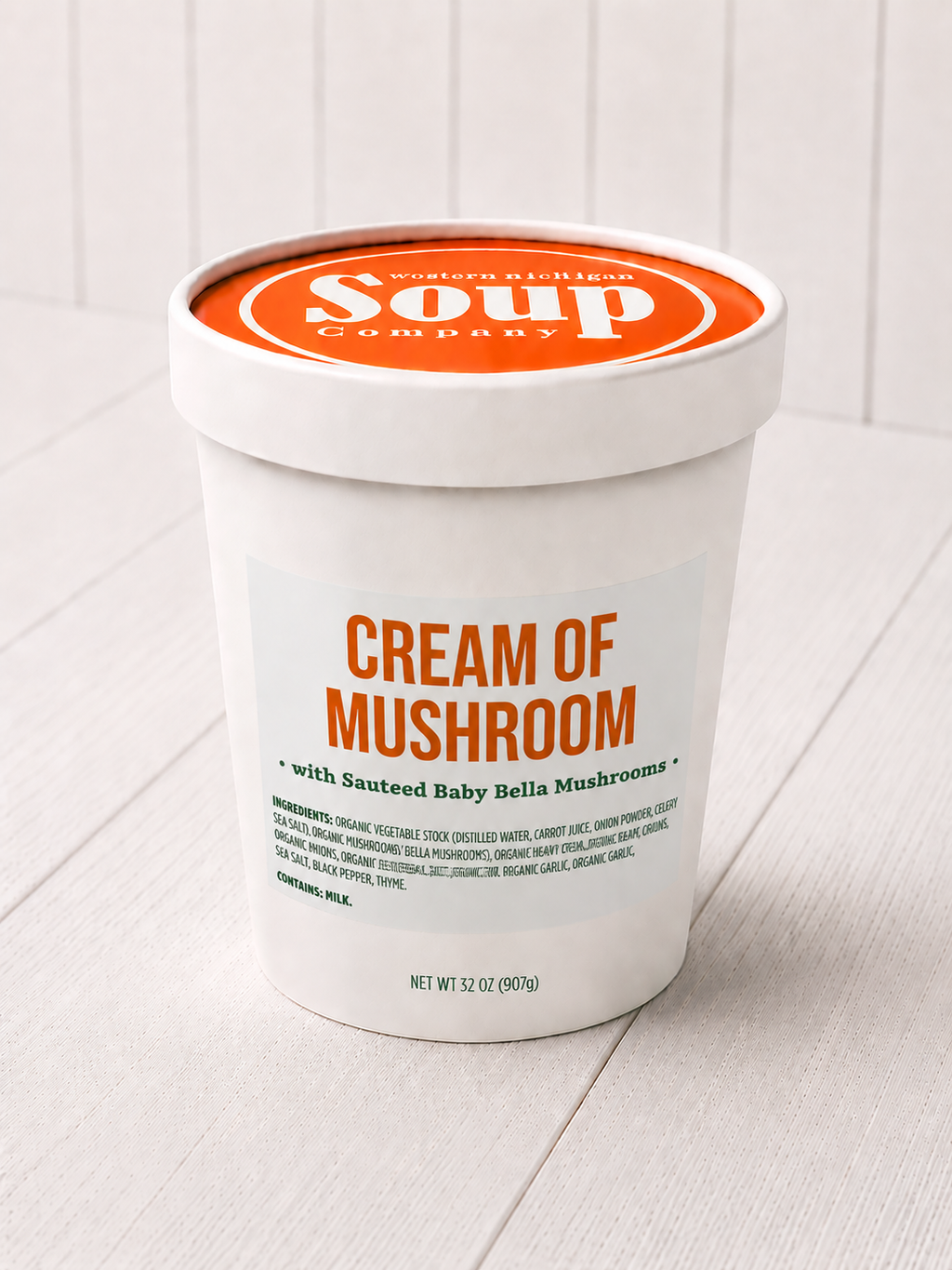 Container of 'Cream of Mushroom' soup from the WISoup Company on a white background