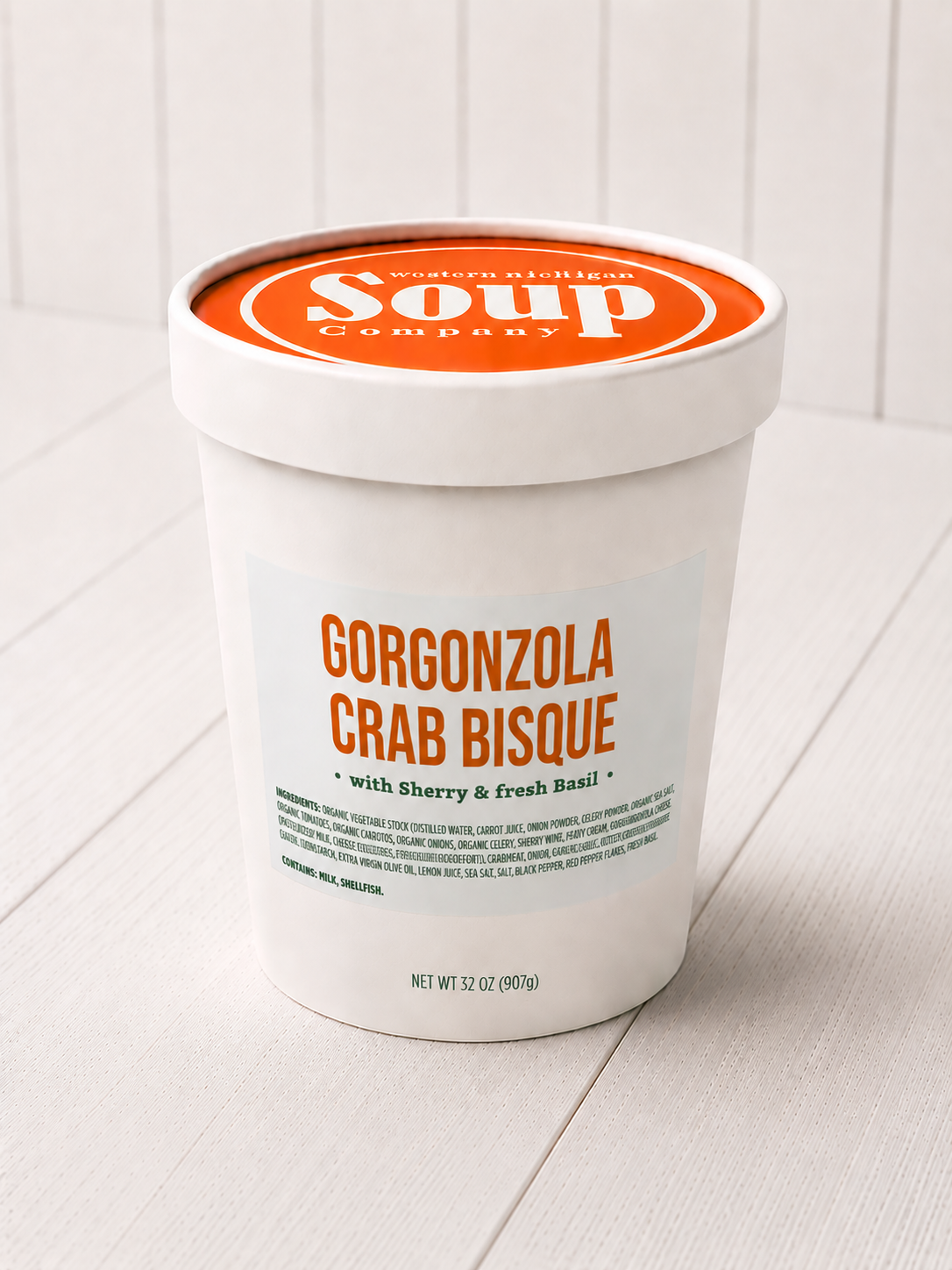 Container of Gorgonzola Crab Bisque soup with 'WISoup Company' branding on a white background