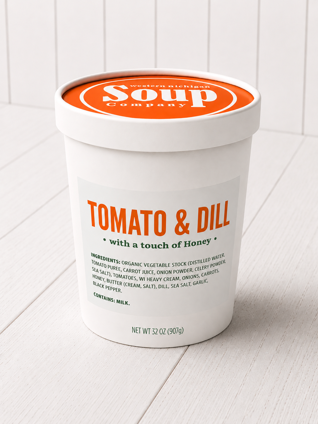 Container of Tomato & Dill soup with a white background