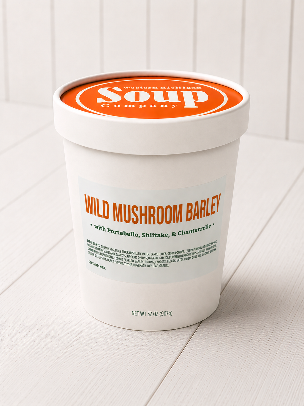 Container of Wild Mushroom Barley soup from the WISoup Company on a white surface.